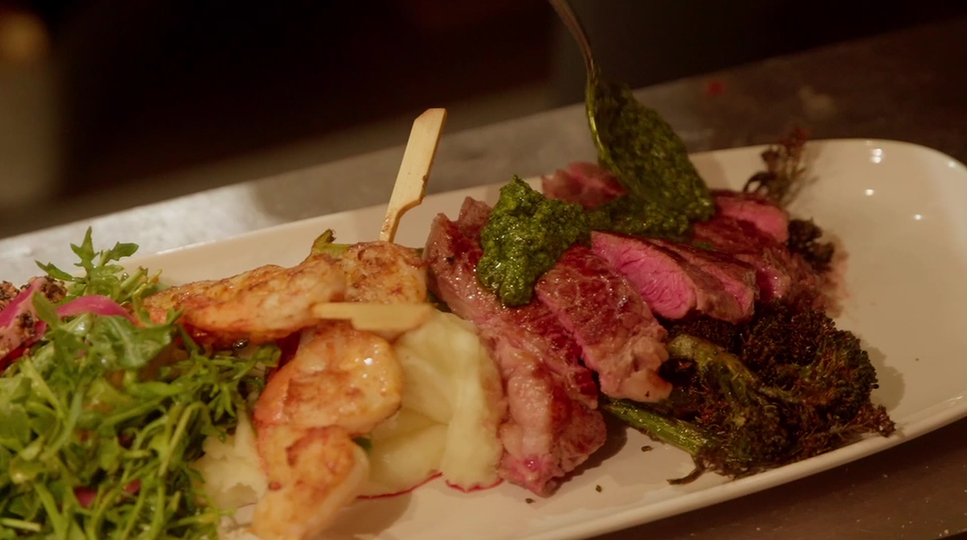 Grilled striploin with chipotle prawns and chimichurri at Monarca, Gastown