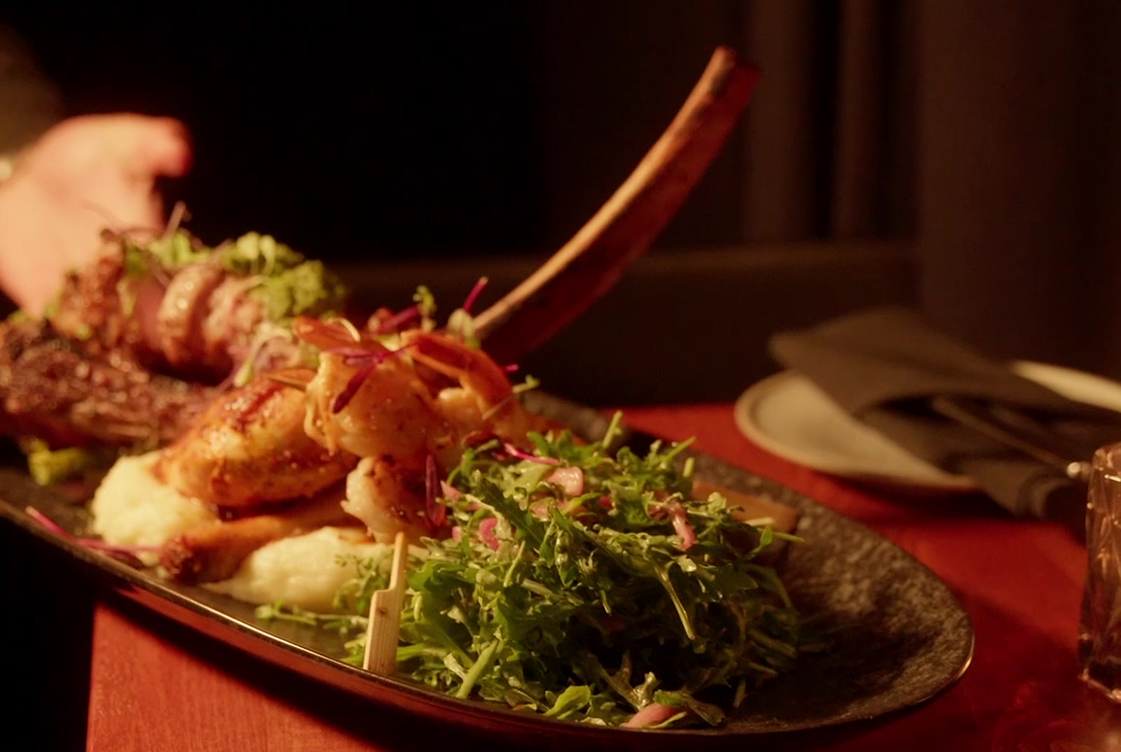 Tomahawk platter served at the table at Monarca, Gastown